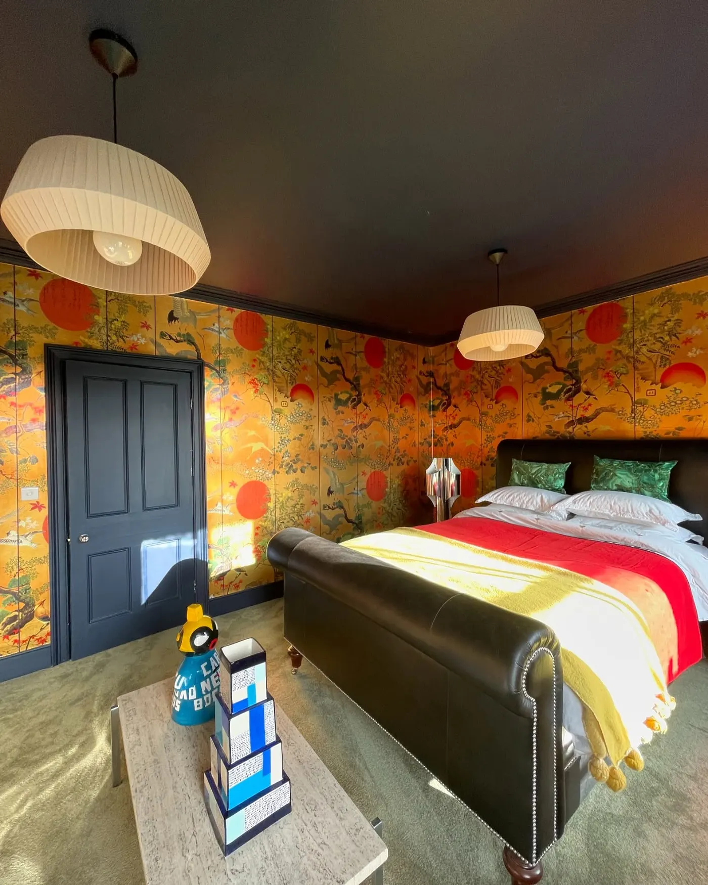 Bedroom with bold patterned wallpaper