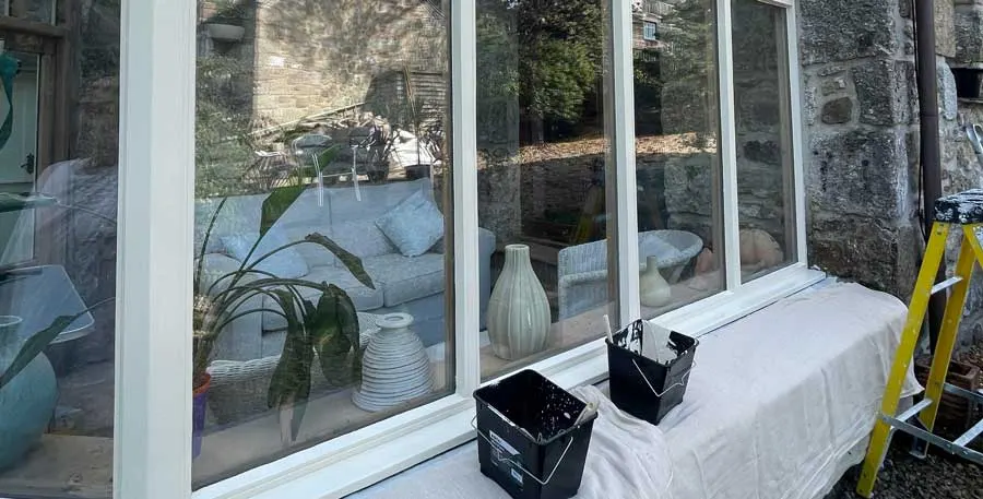 Large windows being decorated with the room protected