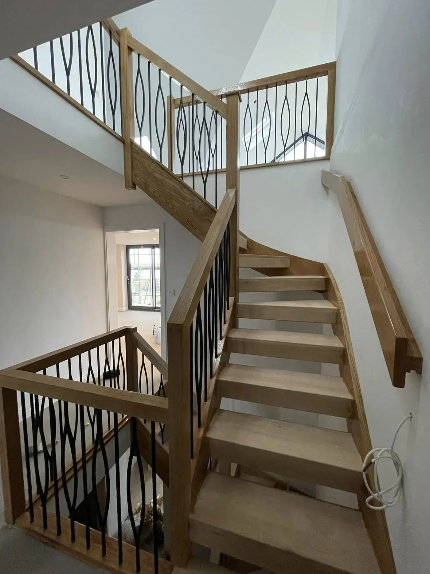 Oak staircase with white walls