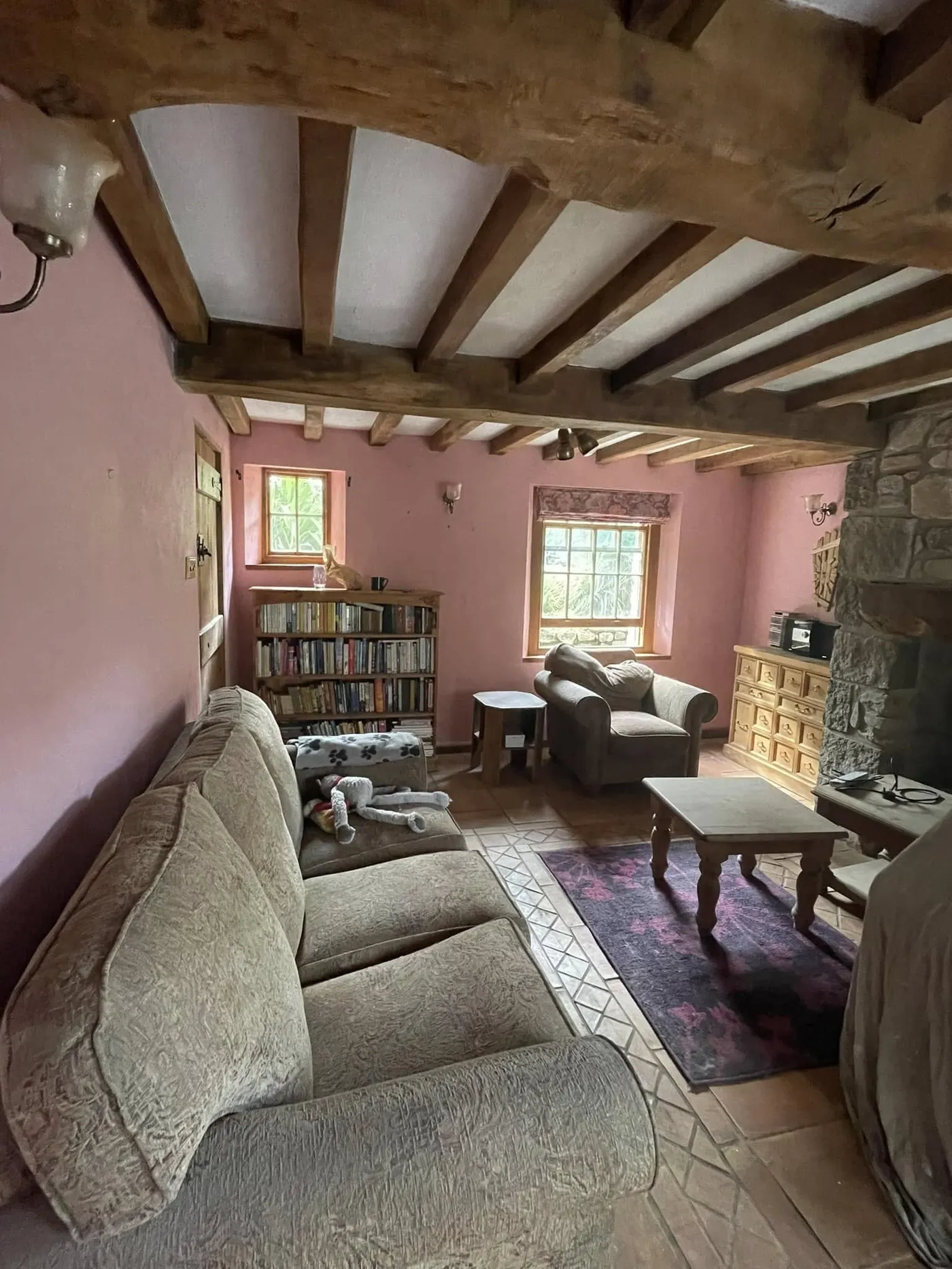 Beamed living room in a soft pink