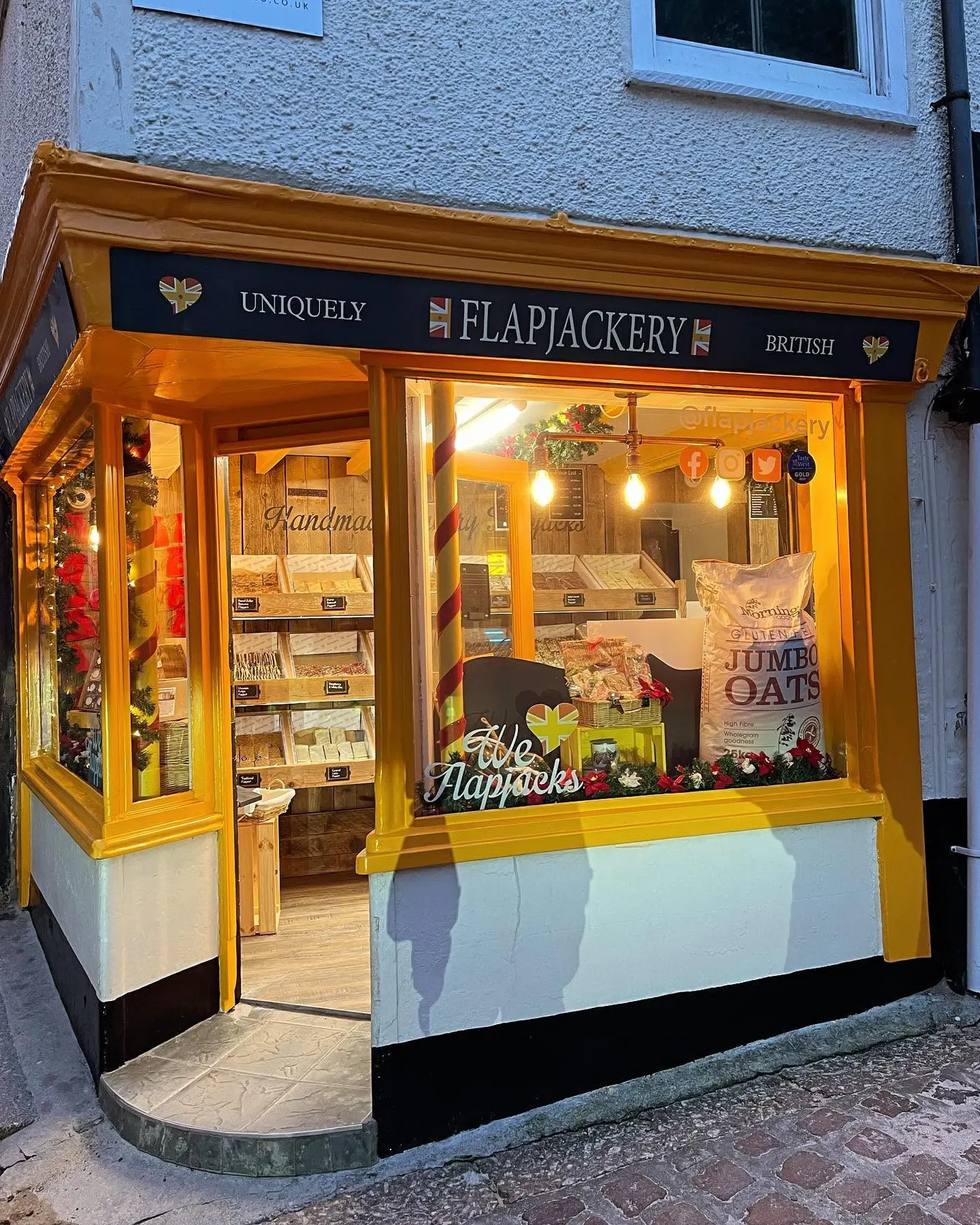 Repainted shop front on a cobbled street