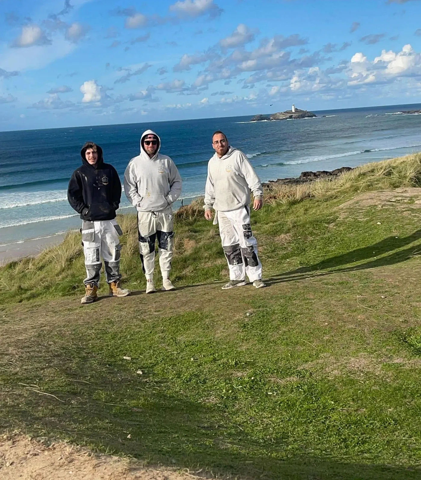 The Coastal Coatings Southwest team on the cliffs above the beach