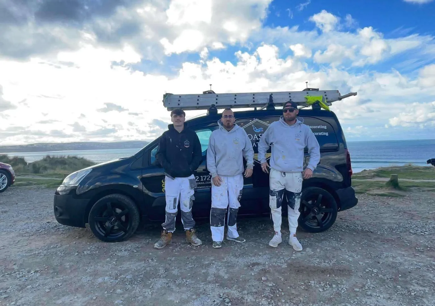 The Coastal Coatings Southwest team with their van on the Cornish coast