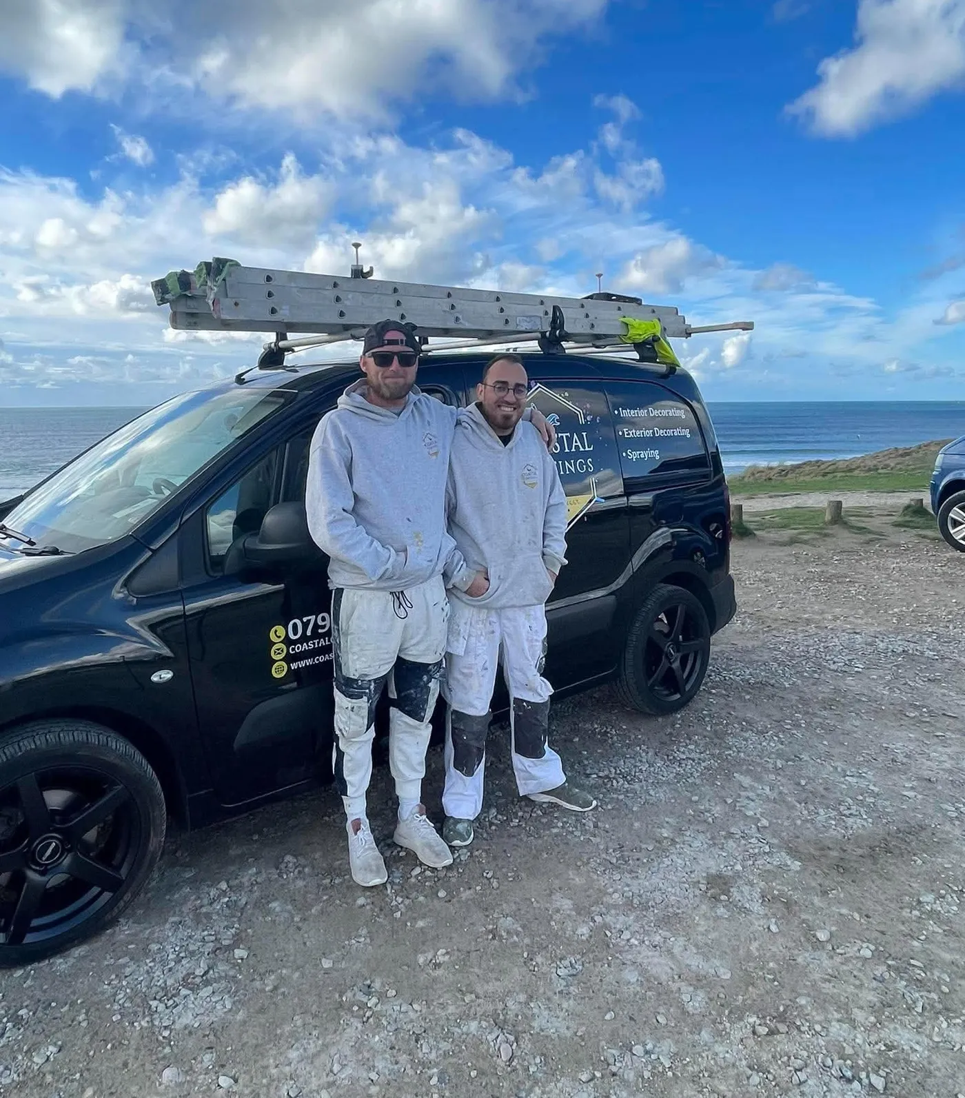 Two of the Coastal Coatings Southwest team with the van