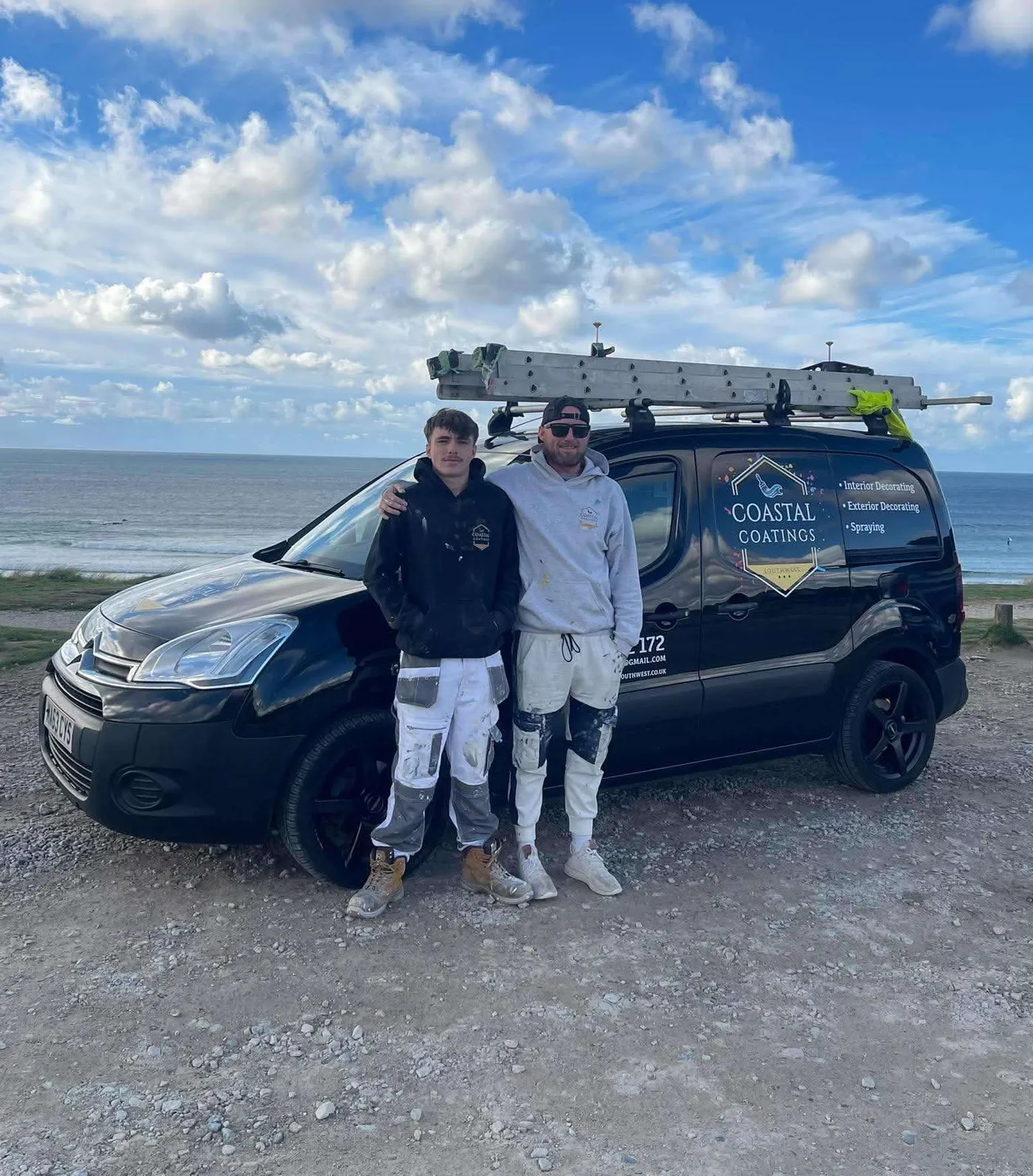 Coastal Coatings Southwest decorators with the company van by the sea
